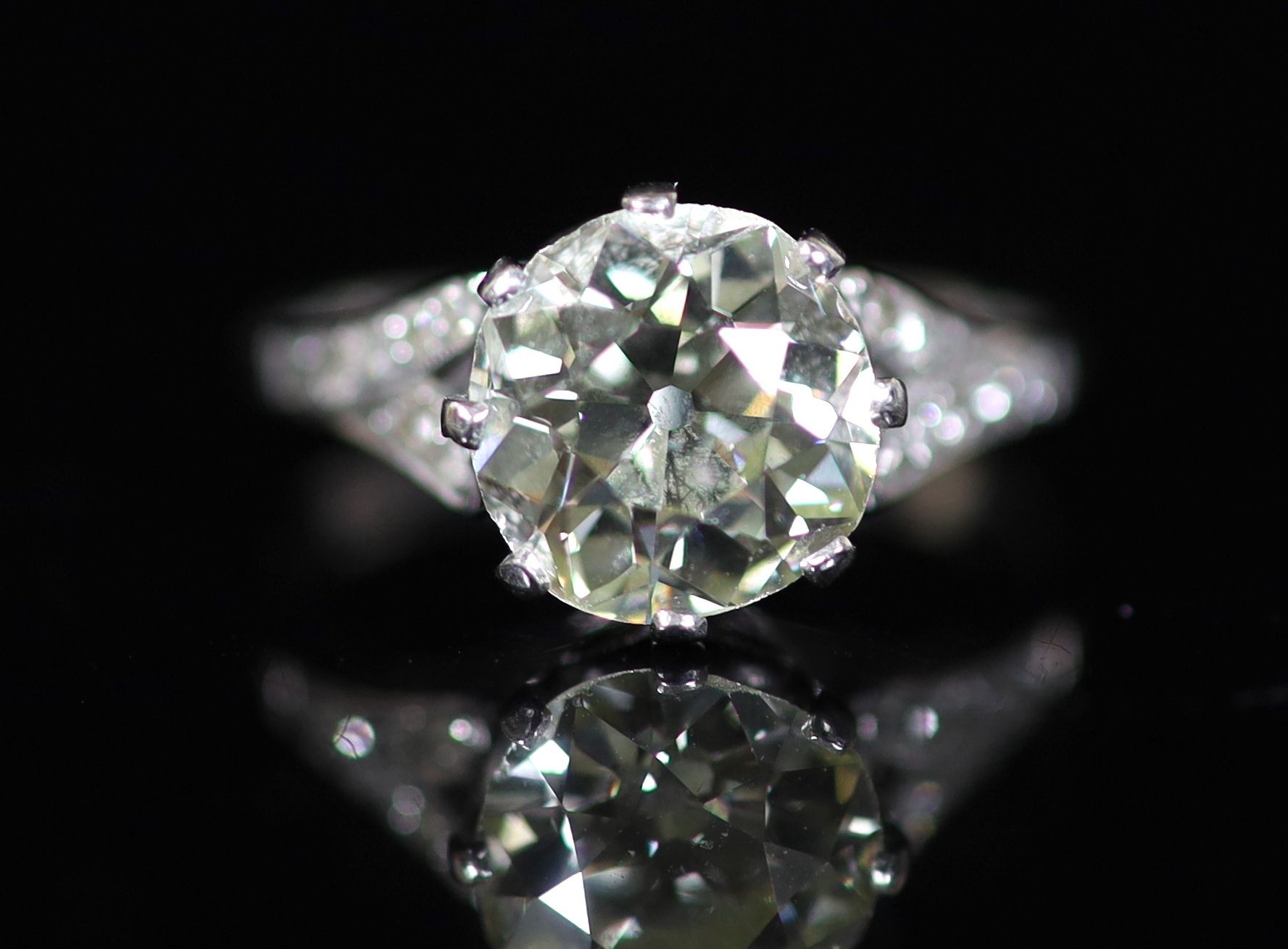 A 20th century 18ct white gold and platinum set single stone diamond ring, with diamond set shoulders